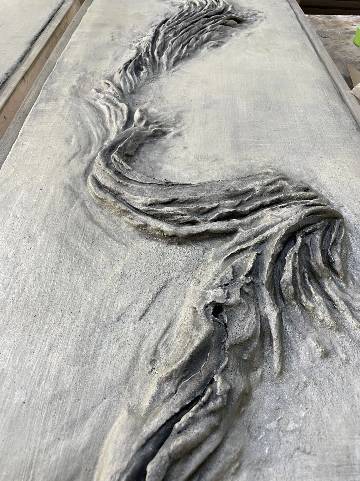 Custom concrete artwork and specialty detail by Coastal Concrete Studio